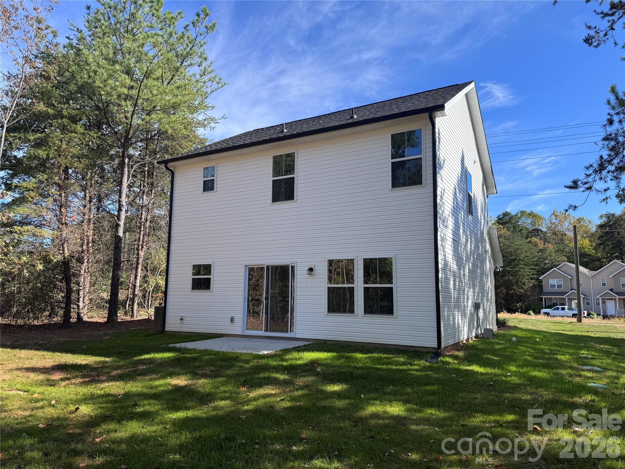 192 Doolie Road Mooresville, NC 28117 - Photo 36 of 36 a backyard of a house with large trees and plants