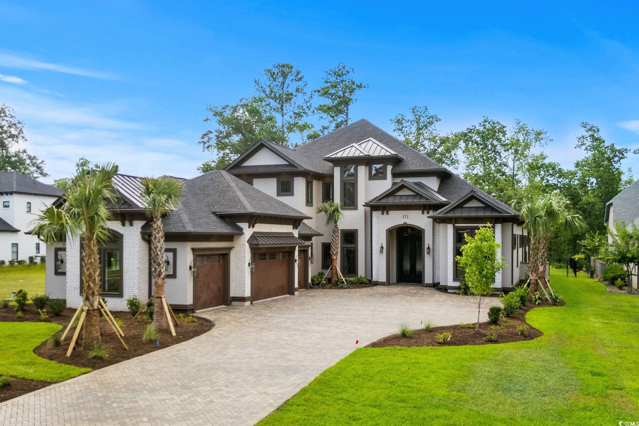 372 Chamberlin Road Myrtle Beach, SC 29588 - Photo 1 of 39 View of front facade featuring decorative driveway