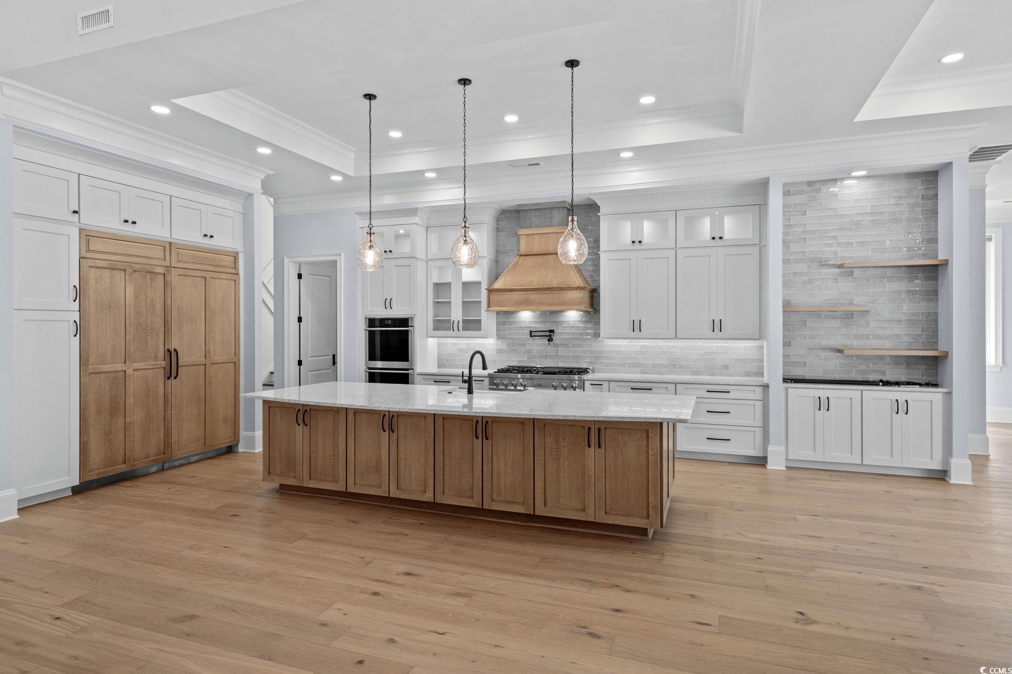 372 Chamberlin Road Myrtle Beach, SC 29588 - Photo 11 of 39 Kitchen with a raised ceiling, premium range hood,