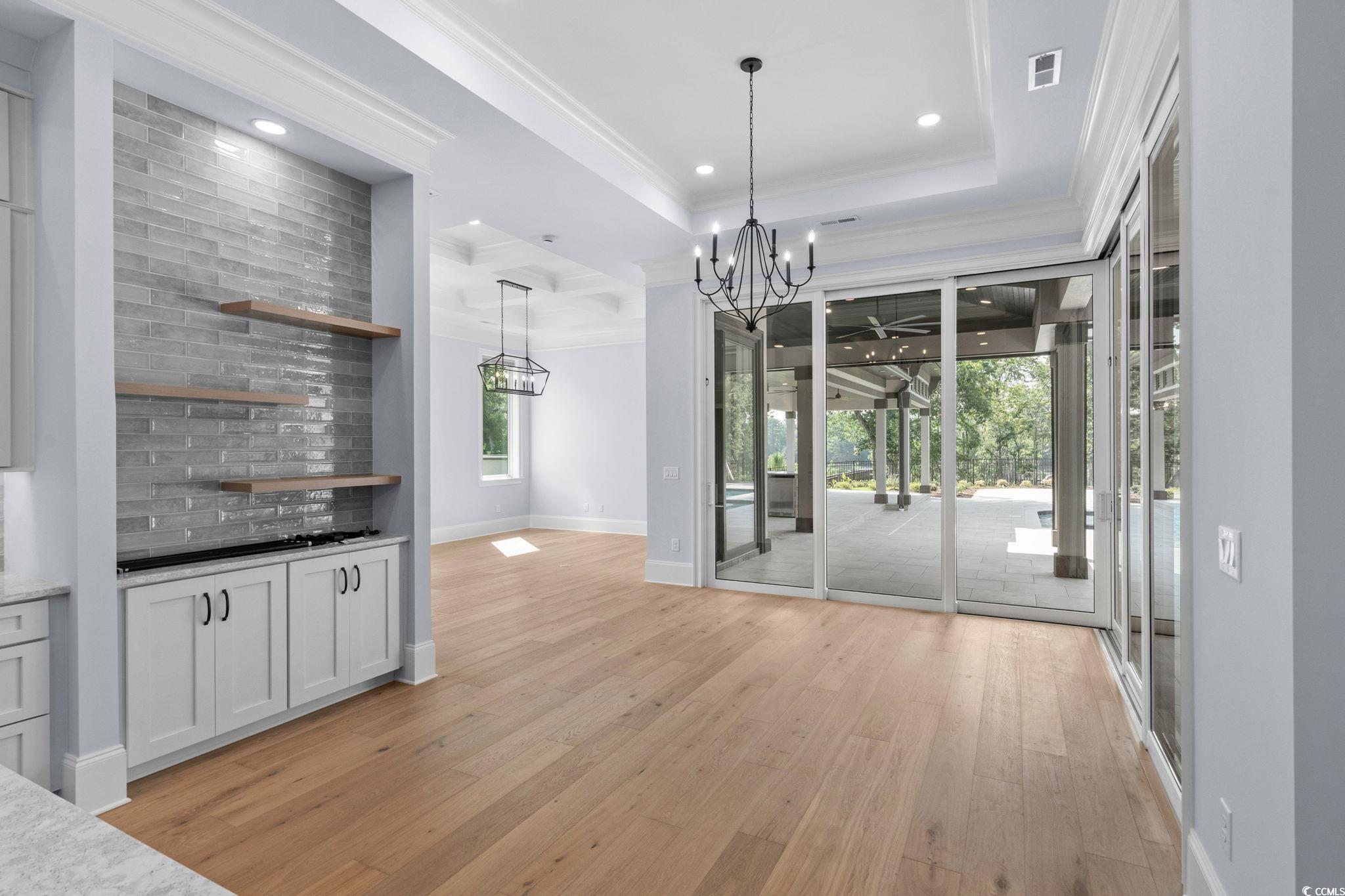 372 Chamberlin Road Myrtle Beach, SC 29588 - Photo 17 of 39 Unfurnished dining area with a chandelier, light w