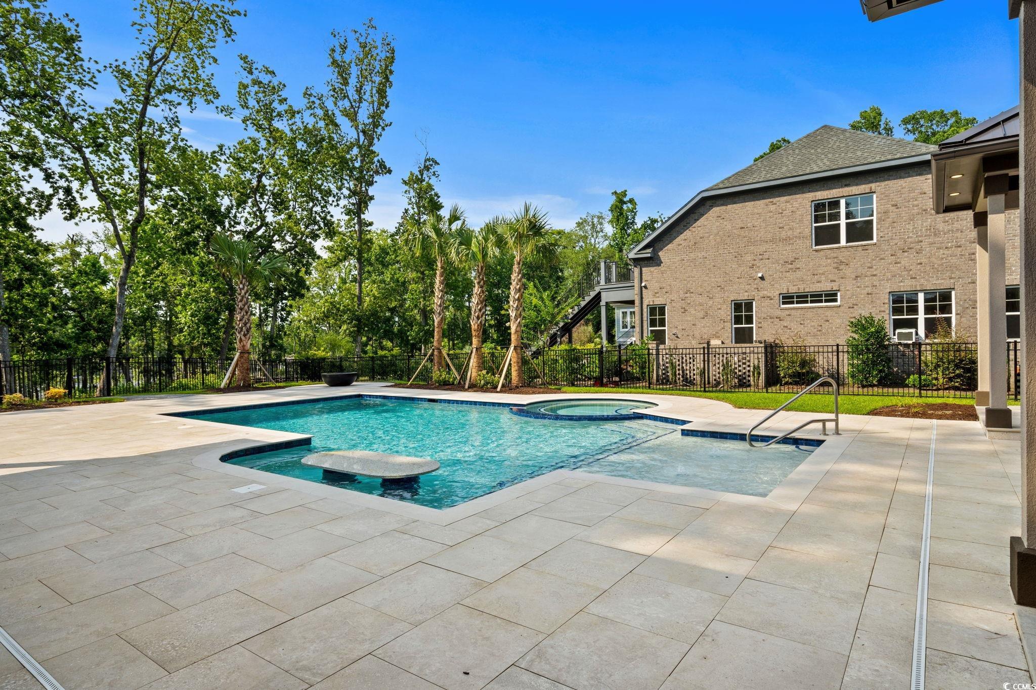 372 Chamberlin Road Myrtle Beach, SC 29588 - Photo 33 of 39 View of pool featuring a patio, a pool with connec