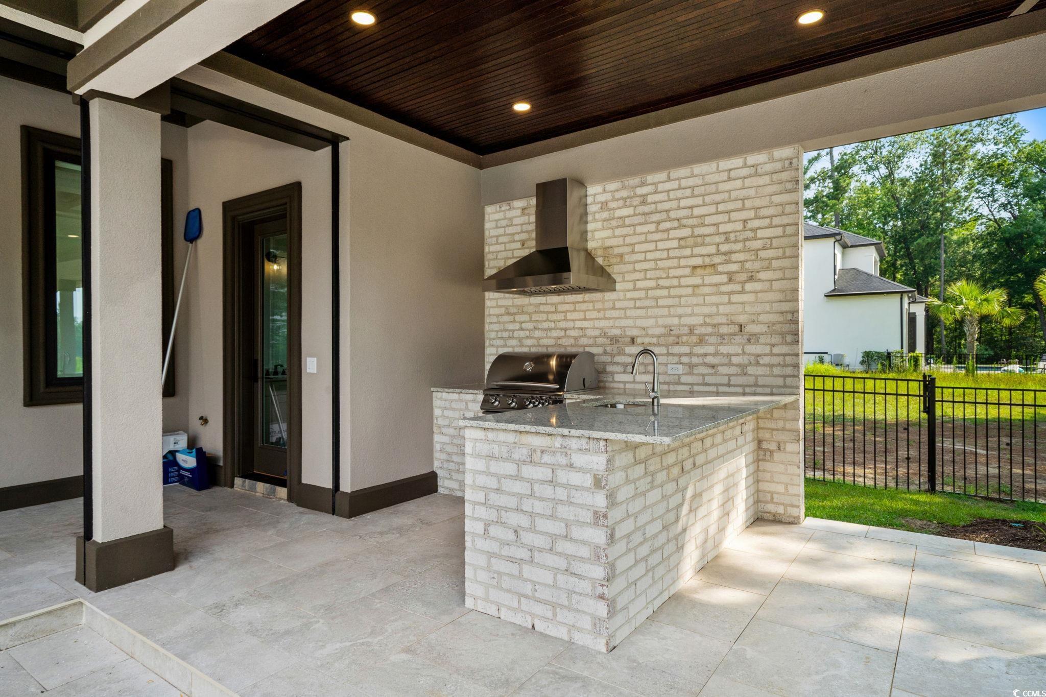 372 Chamberlin Road Myrtle Beach, SC 29588 - Photo 35 of 39 View of patio featuring an outdoor kitchen and a s