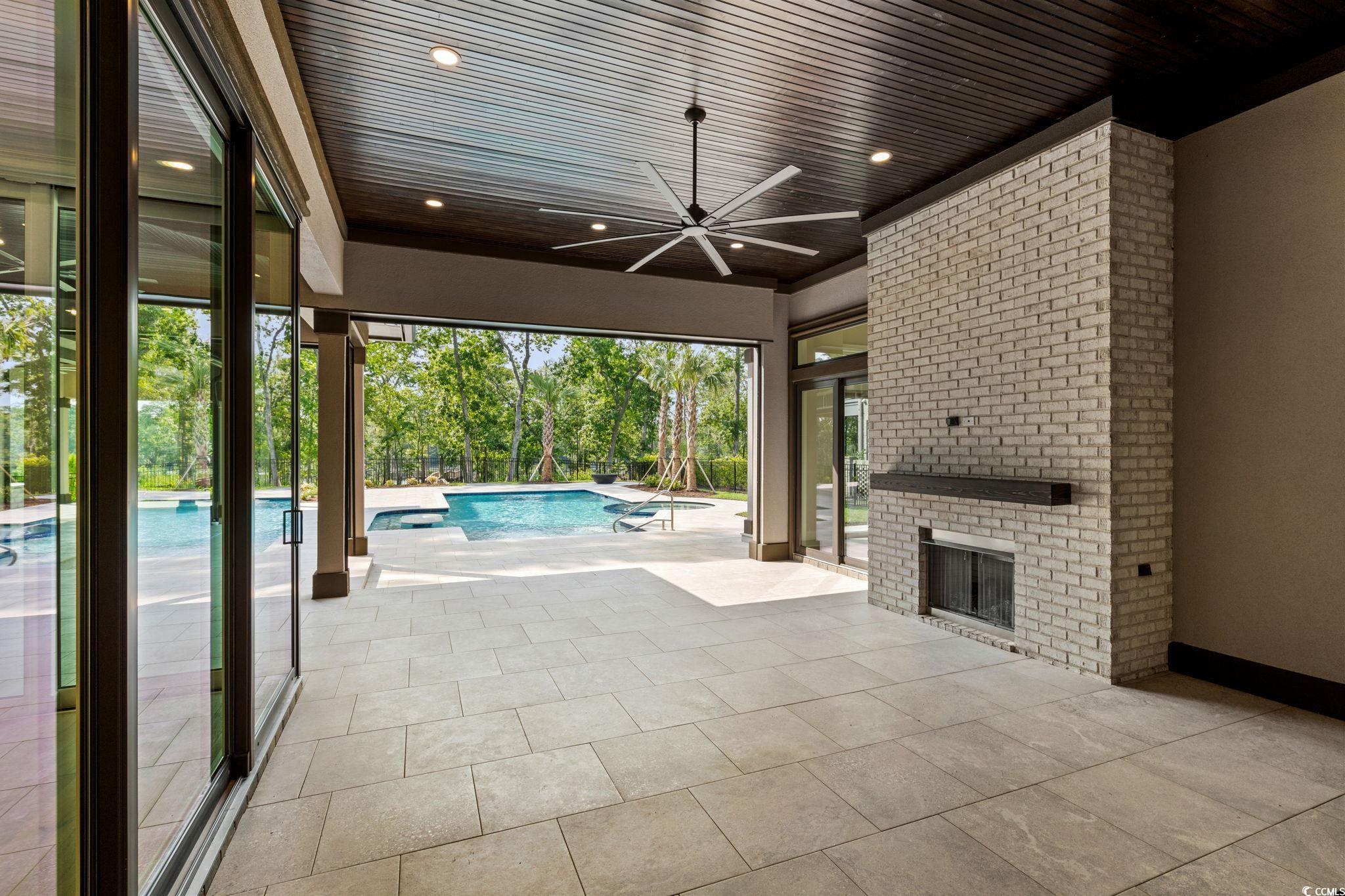 372 Chamberlin Road Myrtle Beach, SC 29588 - Photo 36 of 39 View of patio featuring a ceiling fan and an outdo