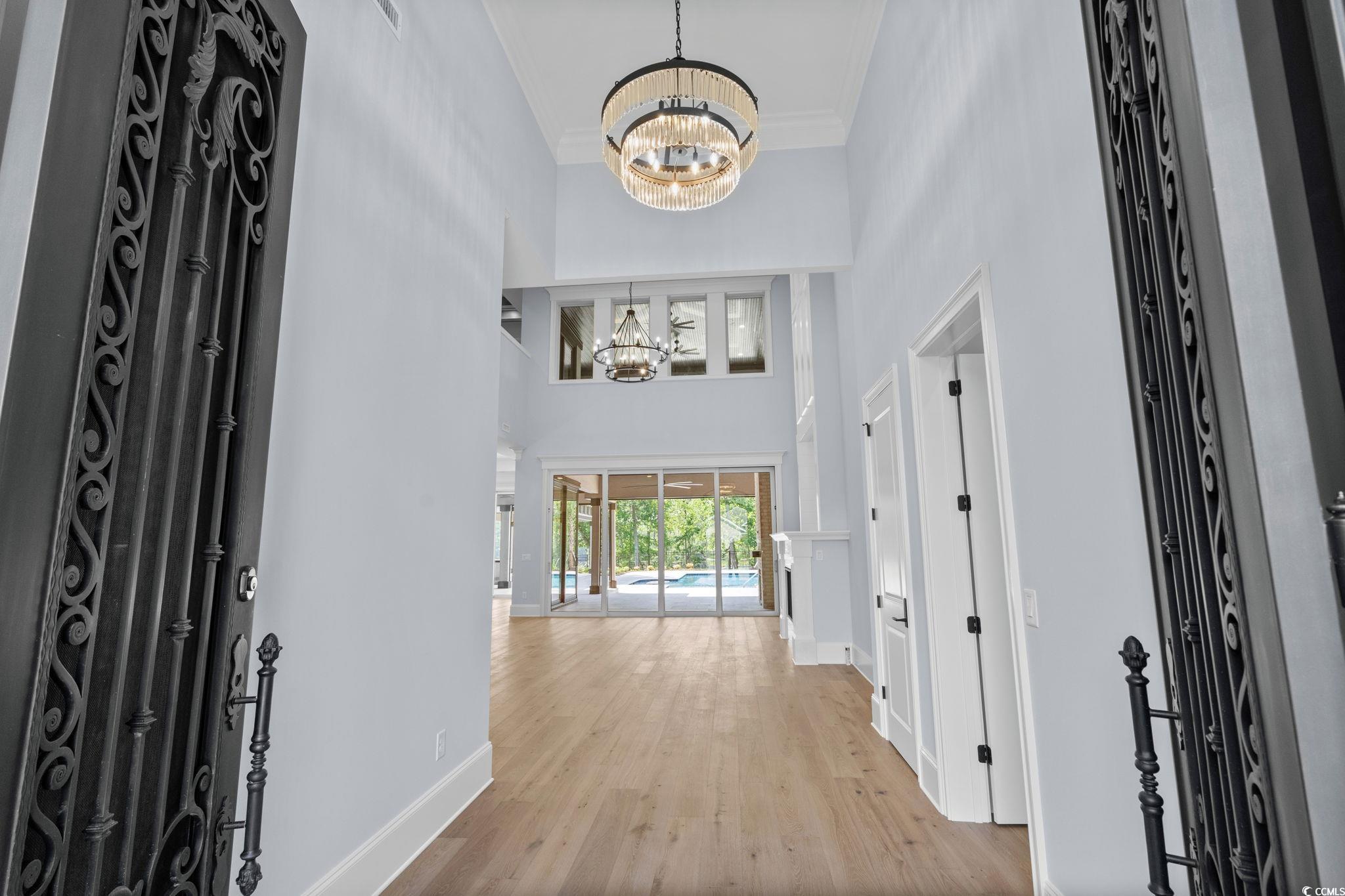 372 Chamberlin Road Myrtle Beach, SC 29588 - Photo 5 of 39 Foyer featuring a chandelier, a towering ceiling,
