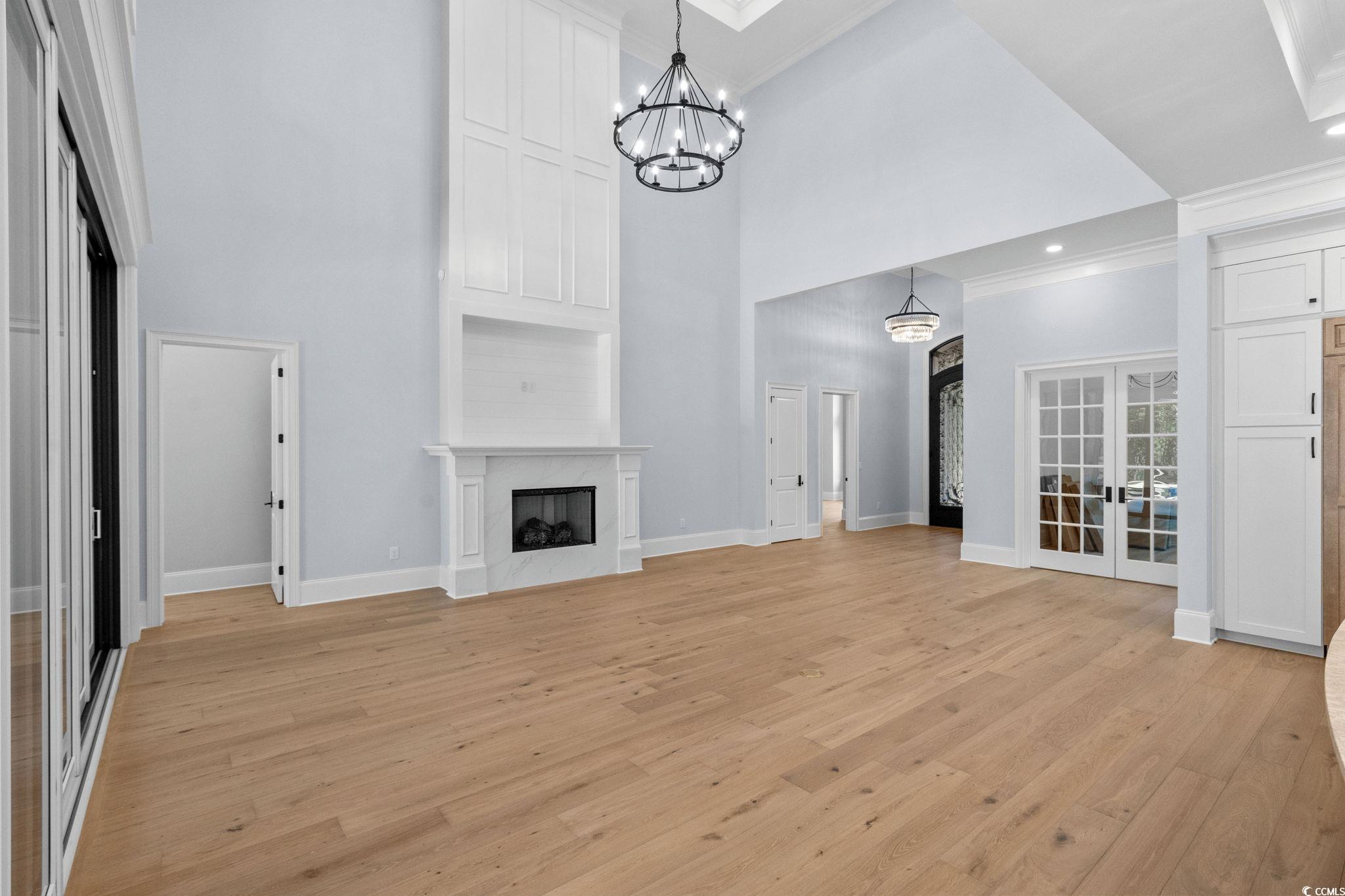 372 Chamberlin Road Myrtle Beach, SC 29588 - Photo 9 of 39 Unfurnished living room featuring a high ceiling,
