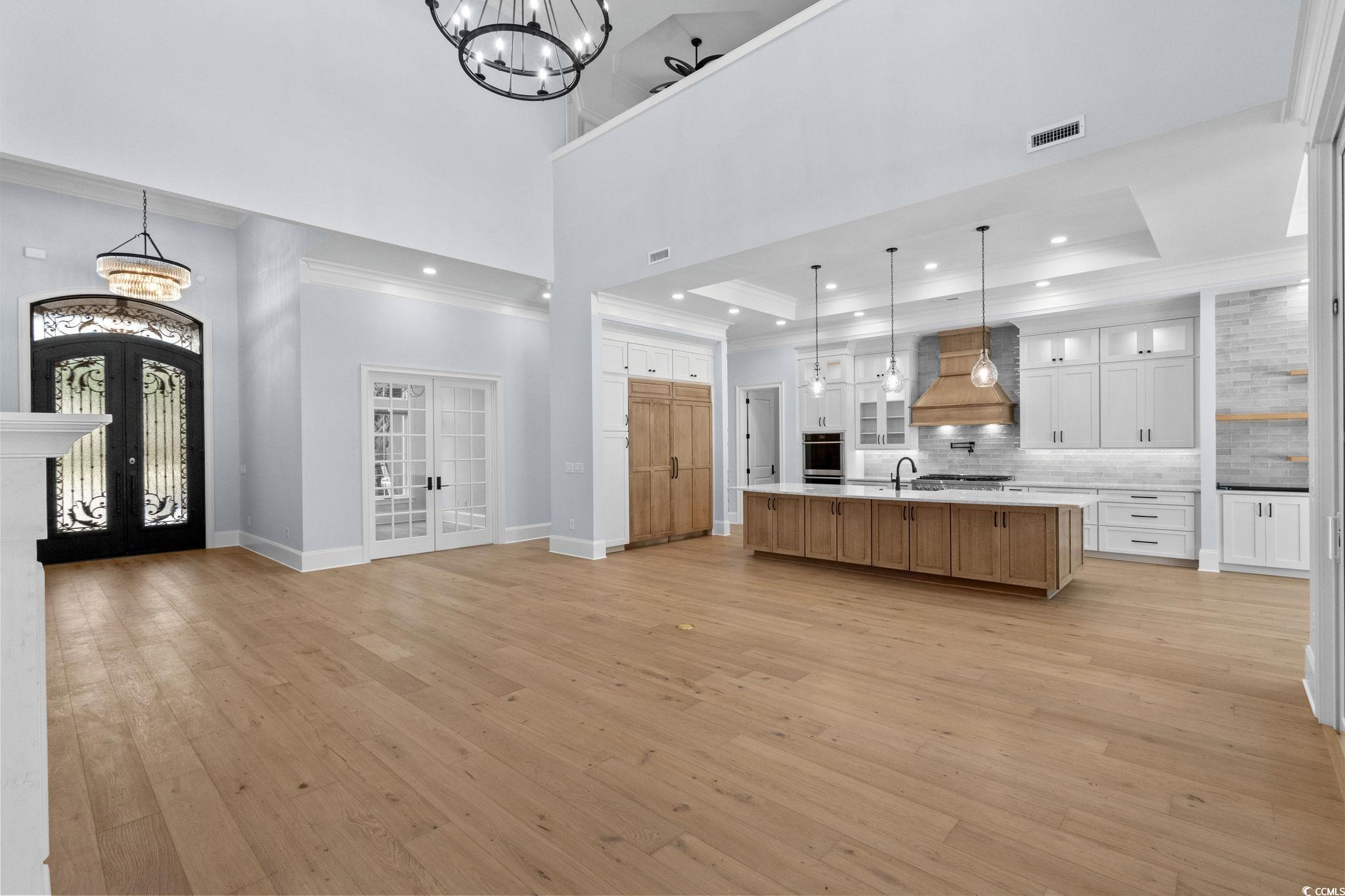 372 Chamberlin Road Myrtle Beach, SC 29588 - Photo 10 of 39 Kitchen with french doors, a chandelier, custom ra