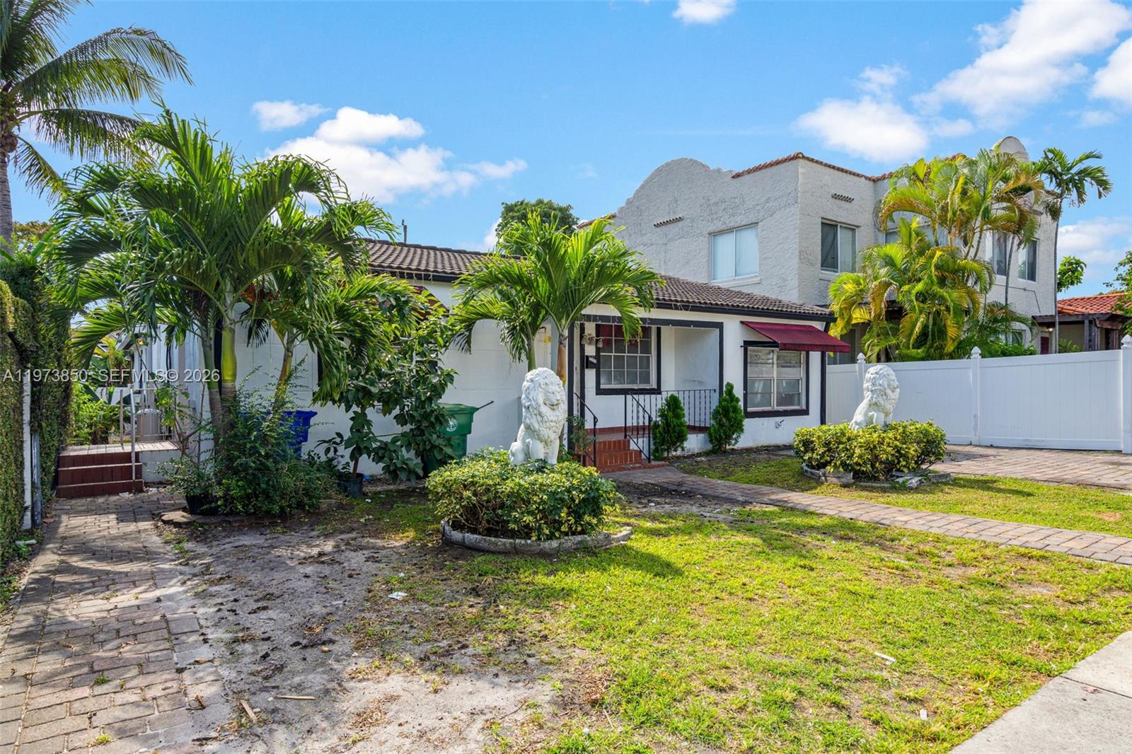 2220 Southwest 16th Terrace Miami, FL 33145 - Photo 2 of 12 a view of a house with swimming pool and a yard