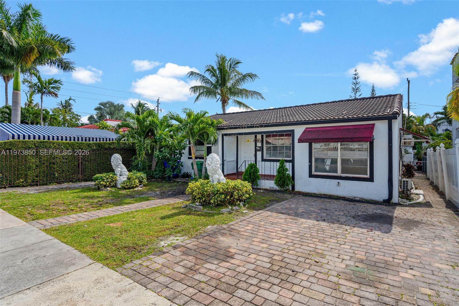 2220 Southwest 16th Terrace Miami, FL 33145 - Photo 3 of 12 a front view of a house with garden