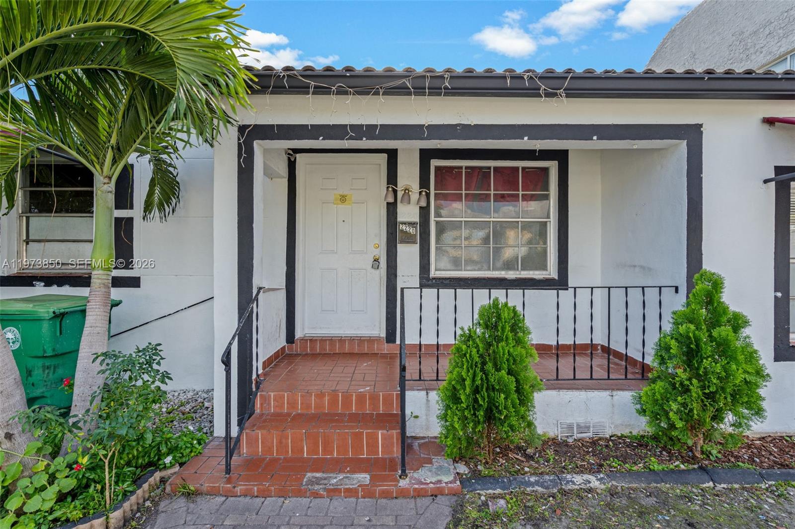 2220 Southwest 16th Terrace Miami, FL 33145 - Photo 4 of 12 a front view of a house with garden