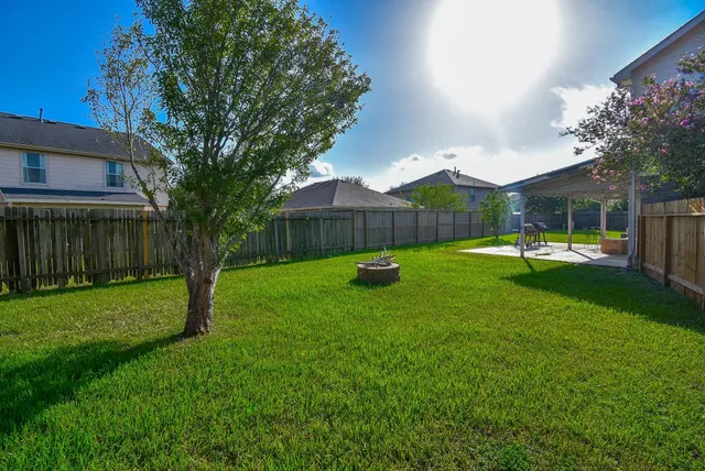 a view of a house with a yard porch and sitting area
