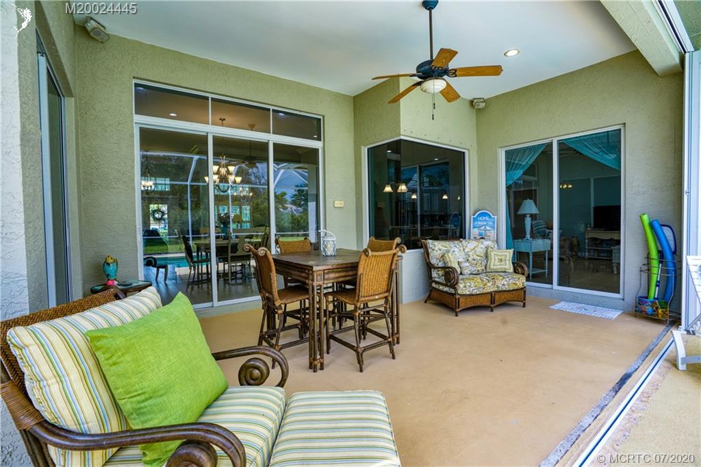 2198 Southwest Mainsail Terrace Stuart, FL 34997 - Photo 18 of 68 a living room with furniture and a large window