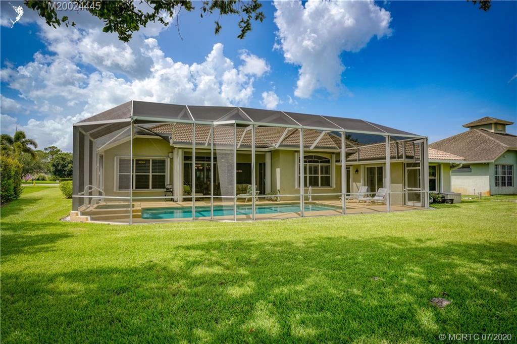 2198 Southwest Mainsail Terrace Stuart, FL 34997 - Photo 35 of 68 a view of a house with a yard and sitting area
