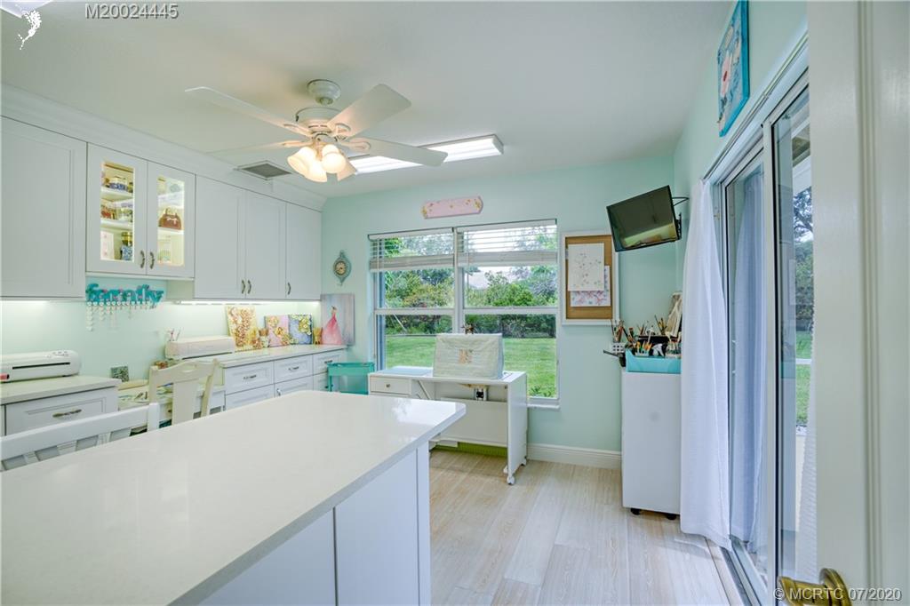 2198 Southwest Mainsail Terrace Stuart, FL 34997 - Photo 37 of 68 a kitchen with a sink appliances and cabinets