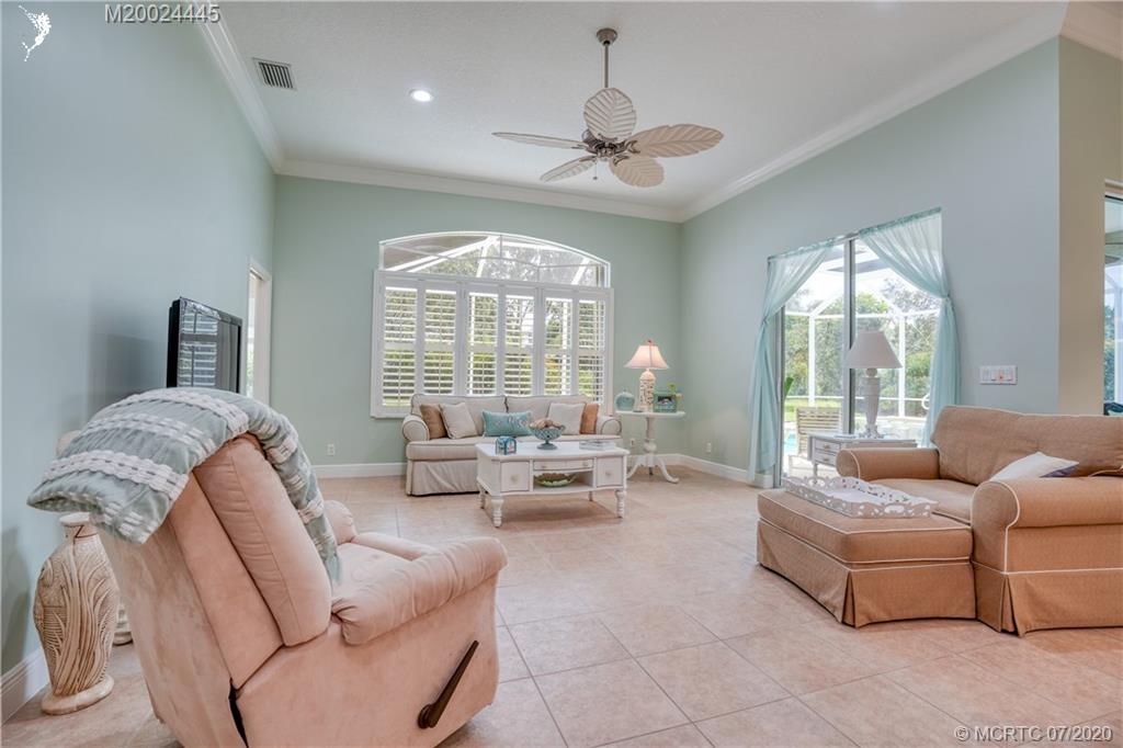 2198 Southwest Mainsail Terrace Stuart, FL 34997 - Photo 50 of 68 a living room with furniture and a large window