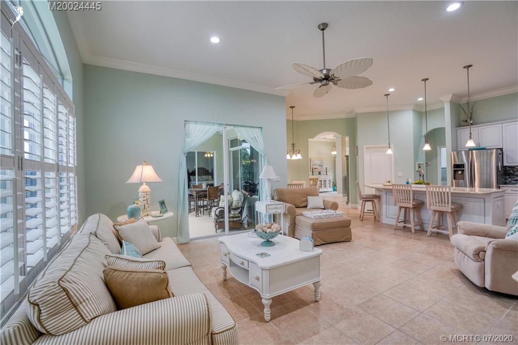 2198 Southwest Mainsail Terrace Stuart, FL 34997 - Photo 51 of 68 a living room with furniture and a chandelier