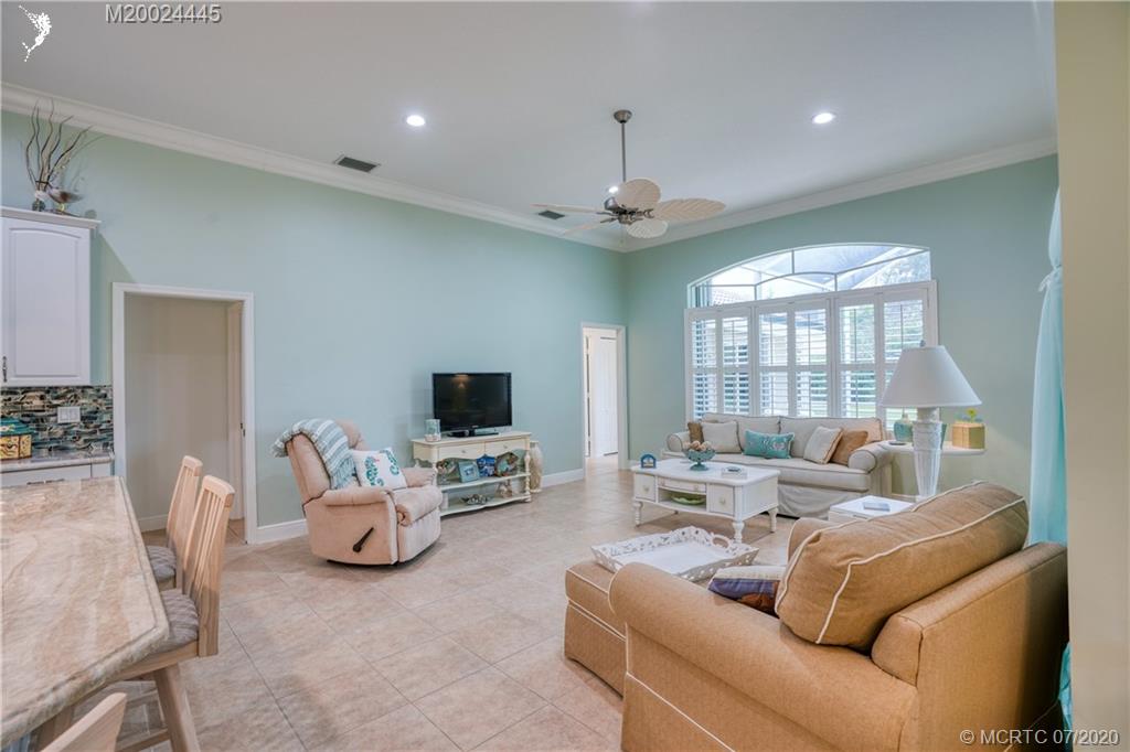 2198 Southwest Mainsail Terrace Stuart, FL 34997 - Photo 53 of 68 a living room with furniture and a flat screen tv