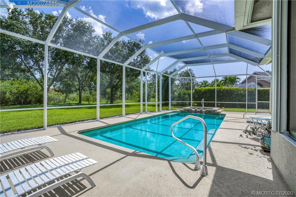 2198 Southwest Mainsail Terrace Stuart, FL 34997 - Photo 56 of 68 a view of a backyard with swimming pool