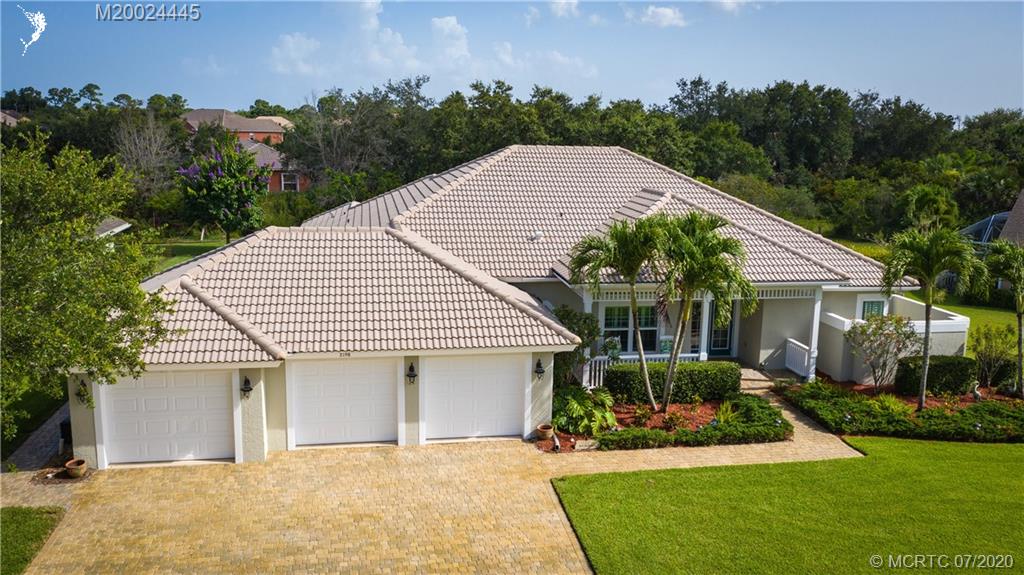 2198 Southwest Mainsail Terrace Stuart, FL 34997 - Photo 58 of 68 a front view of house with yard and green space