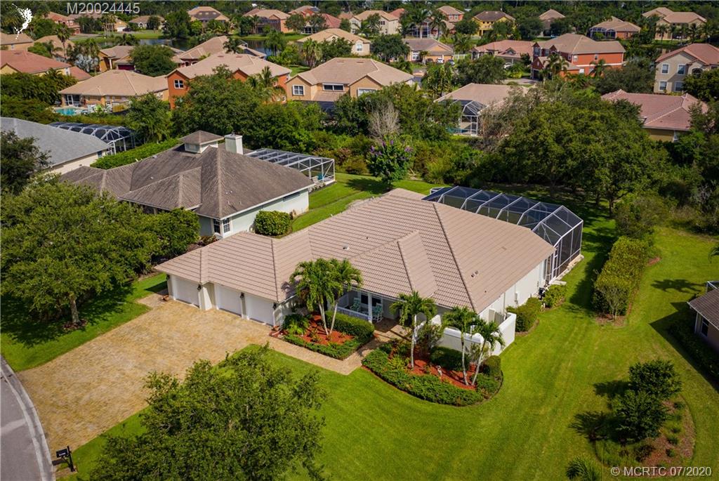 2198 Southwest Mainsail Terrace Stuart, FL 34997 - Photo 59 of 68 an aerial view of a house with swimming pool outdoor seating and yard