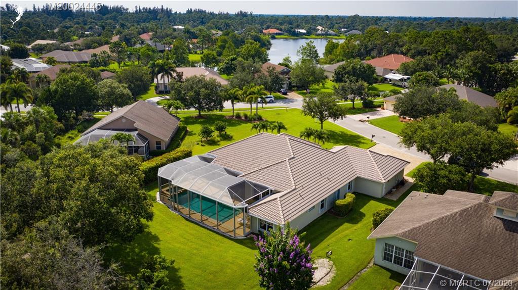 2198 Southwest Mainsail Terrace Stuart, FL 34997 - Photo 61 of 68 an aerial view of a house with a garden