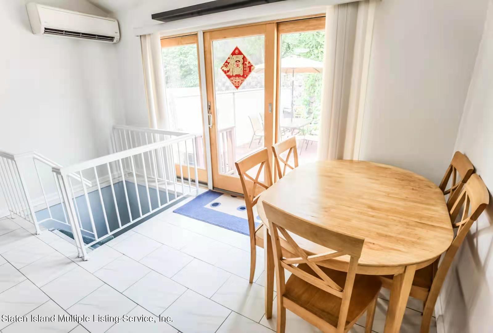 44 Chesebrough Street Staten Island, NY 10312 - Photo 19 of 24 a view of a dining room with furniture window and outside view