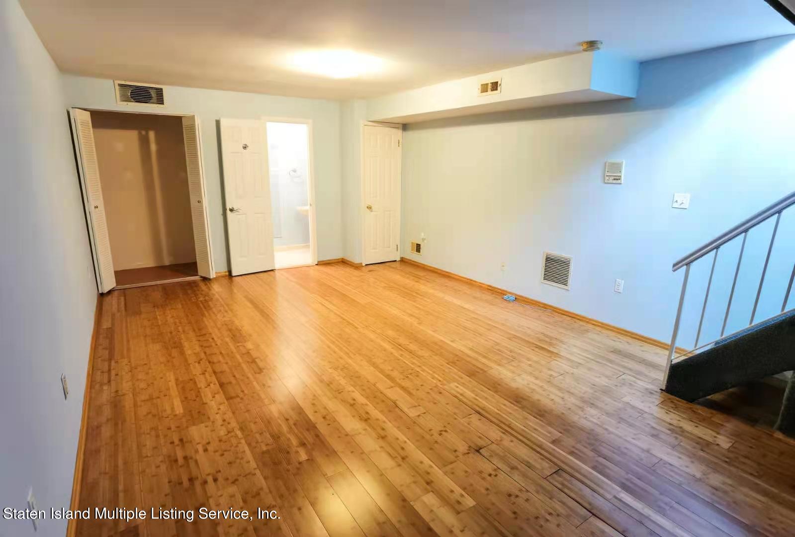 44 Chesebrough Street Staten Island, NY 10312 - Photo 20 of 24 a view of an empty room with wooden floor