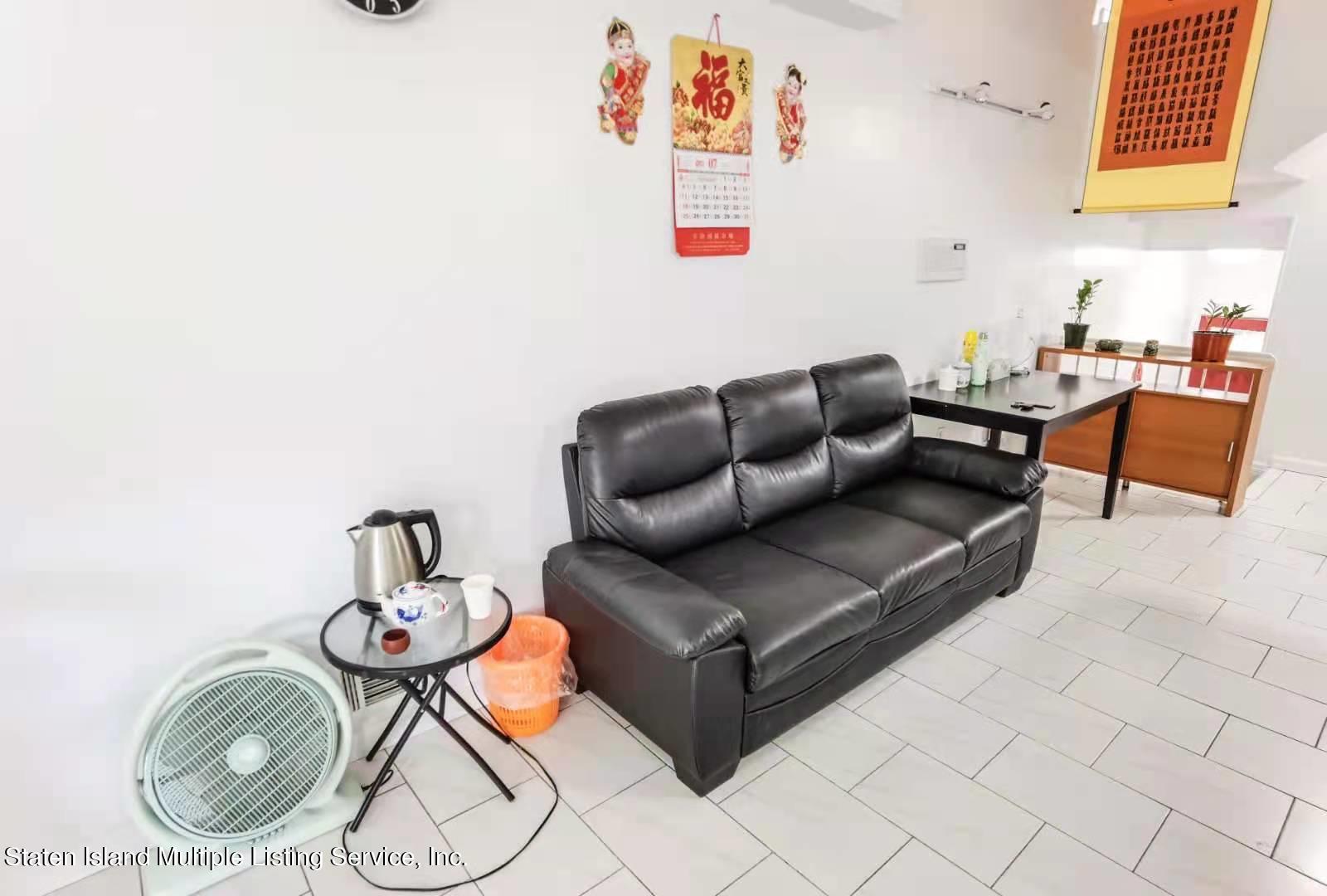 44 Chesebrough Street Staten Island, NY 10312 - Photo 22 of 24 a living room with furniture and wooden floor