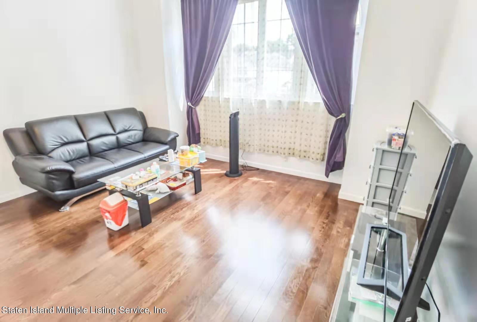 44 Chesebrough Street Staten Island, NY 10312 - Photo 8 of 24 a living room with furniture and a large window