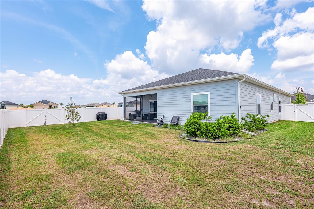5688 Southwest 92nd Place Ocala, FL 34476 - Photo 53 of 54 a view of a house with a garden