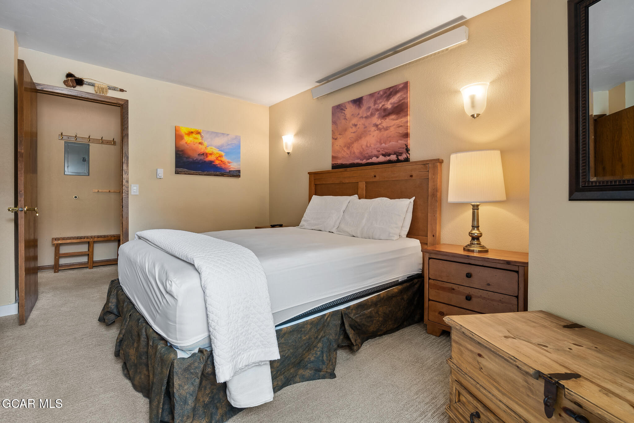 490 Kings Crossing Road, Unit 611 Winter Park, CO 80482 - Photo 22 of 39 a bedroom with a bed and a painting on the wall