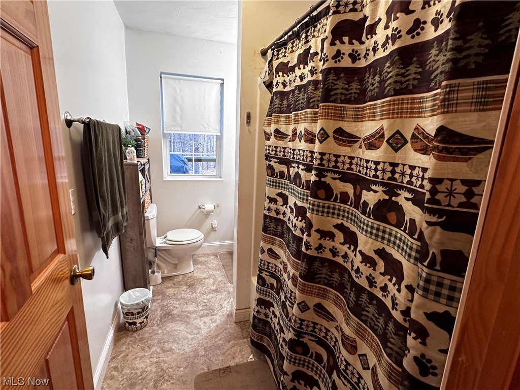 50748 Shenandoah Road Caldwell, OH 43724 - Photo 13 of 43 Bathroom featuring toilet and vinyl floors