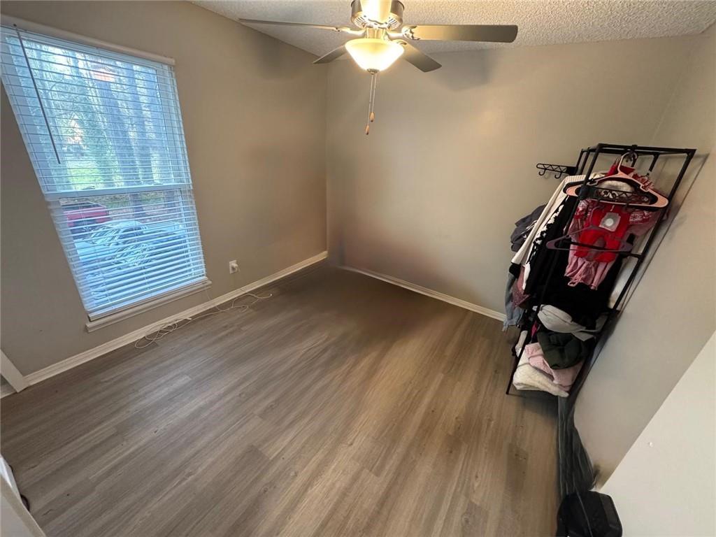 5298 Miller Road Southwest Lilburn, GA 30047 - Photo 4 of 6 a view of workspace with wooden floor windows