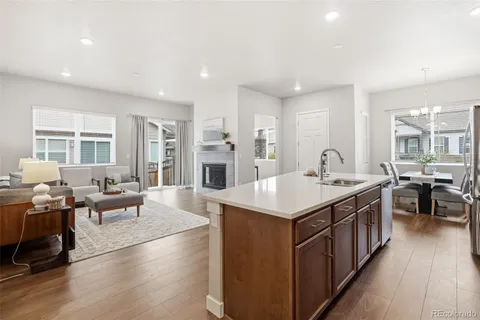 a large kitchen with stainless steel appliances lots of counter space and windows