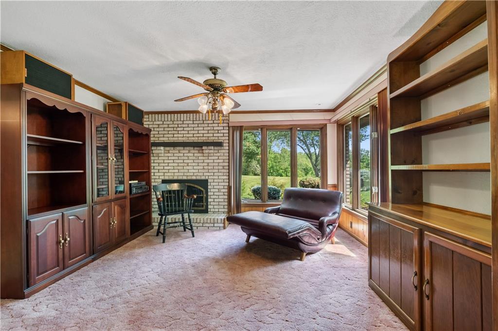 46 Cheslock Road Canonsburg, PA 15317 - Photo 15 of 24 a living room with furniture a fireplace and a flat screen tv