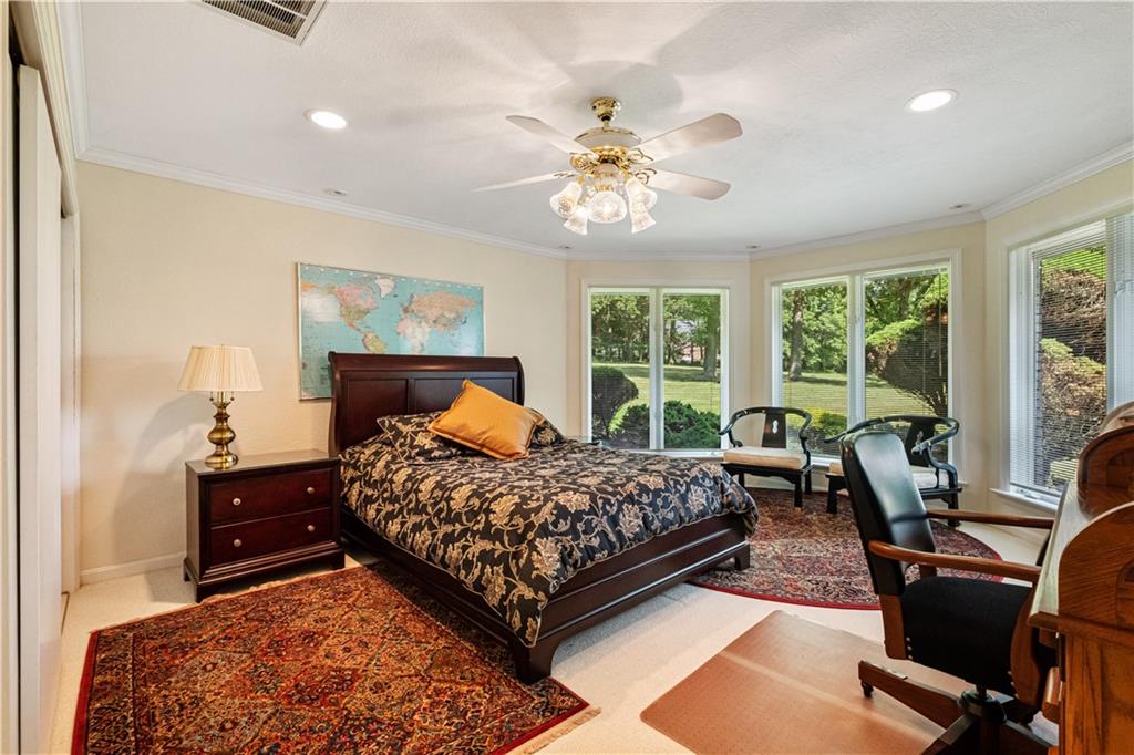 46 Cheslock Road Canonsburg, PA 15317 - Photo 16 of 24 a bedroom with a bed and a chandelier