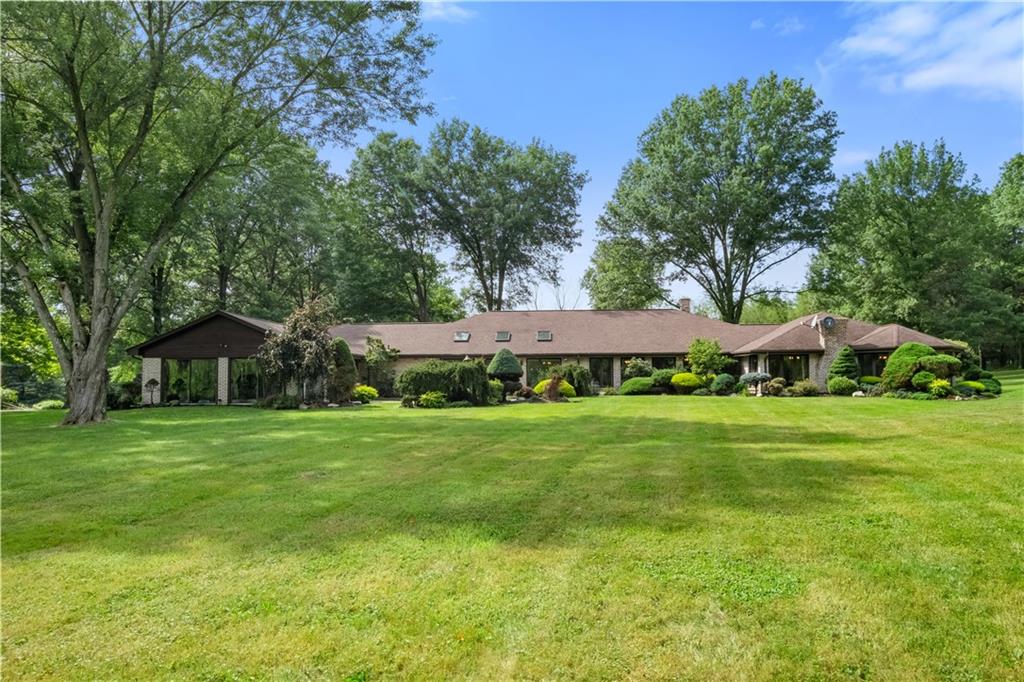 46 Cheslock Road Canonsburg, PA 15317 - Photo 2 of 24 a front view of a house with a garden