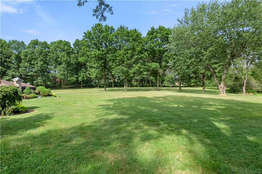46 Cheslock Road Canonsburg, PA 15317 - Photo 23 of 24 a view of a grassy field with trees in the background