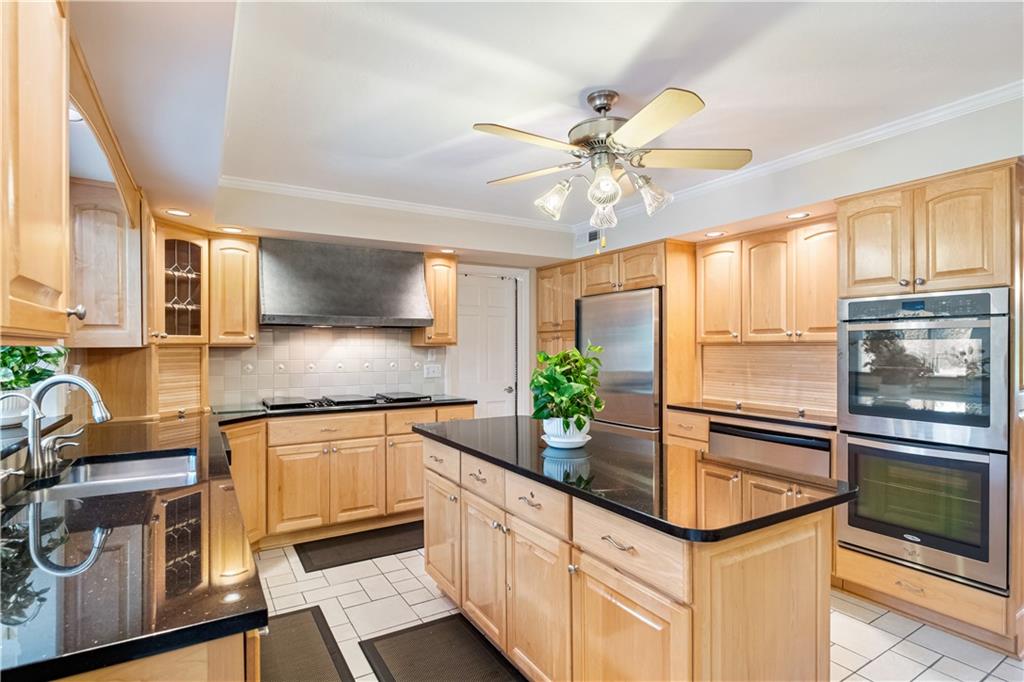 46 Cheslock Road Canonsburg, PA 15317 - Photo 5 of 24 a kitchen with stainless steel appliances a sink a stove and cabinets