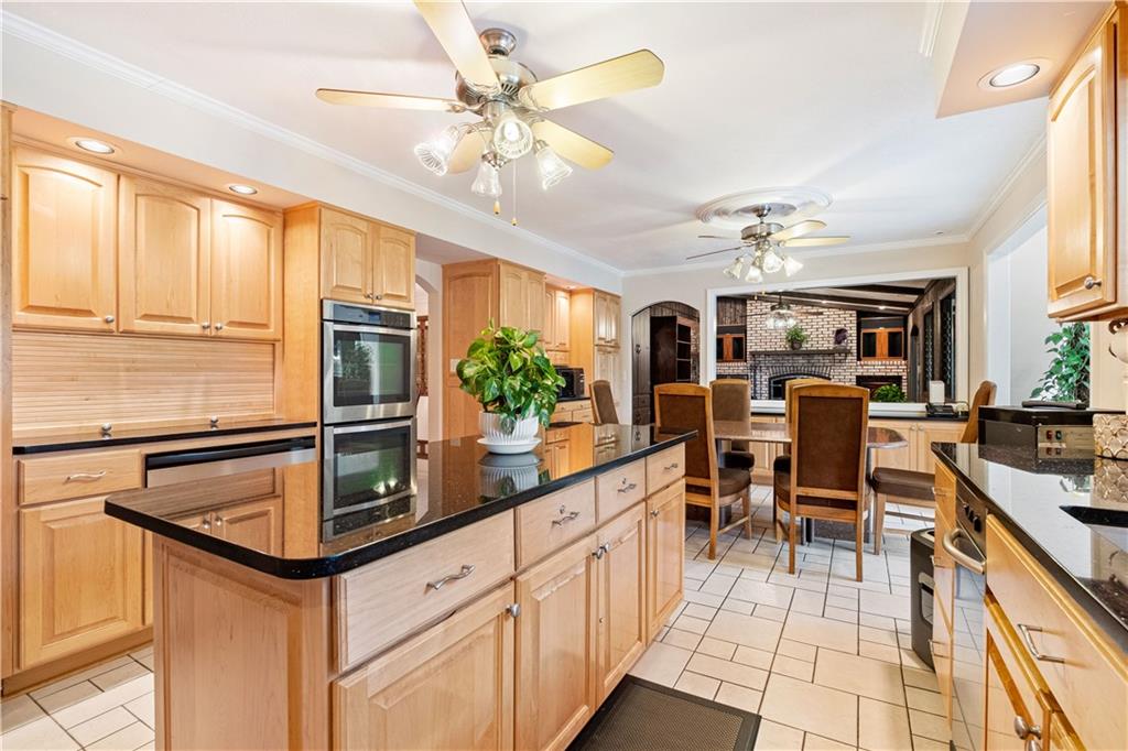46 Cheslock Road Canonsburg, PA 15317 - Photo 6 of 24 a kitchen with stainless steel appliances kitchen island granite countertop a table chairs and a refrigerator
