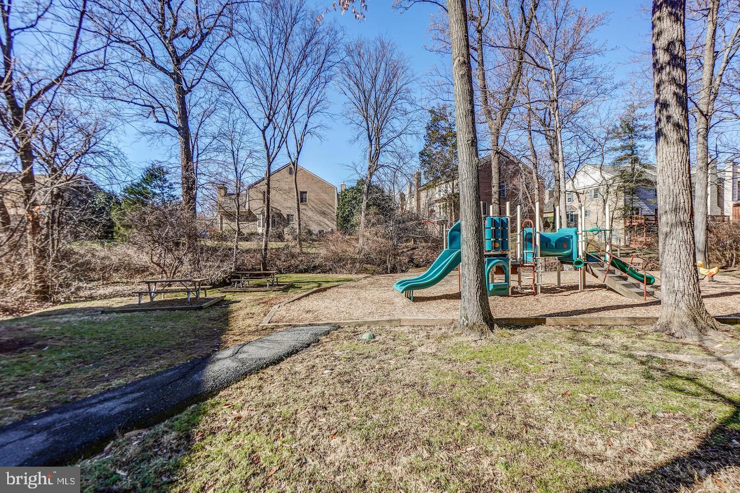 10706 Kings Riding Way, Unit 20118 Rockville, MD 20852 - Photo 21 of 24 a view of a park with large trees