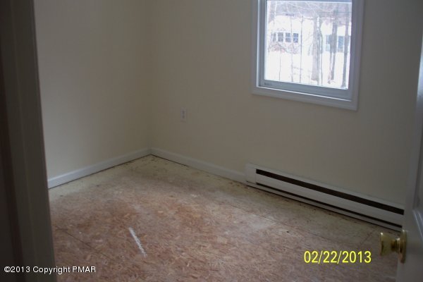 1109 Beechnut Road Effort, PA 18330 - Photo 5 of 8 an empty room with a window