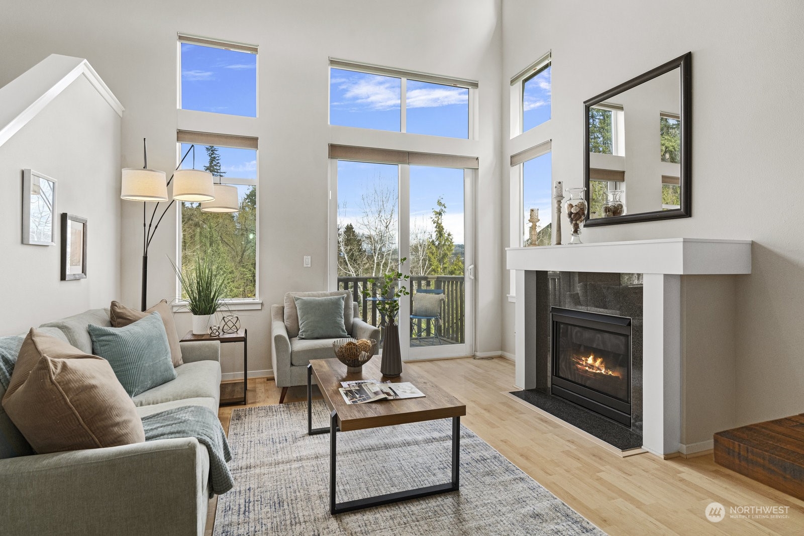 158 Cougar Ridge Road Northwest Issaquah, WA 98027 - Photo 3 of 39 a living room with furniture and a fireplace