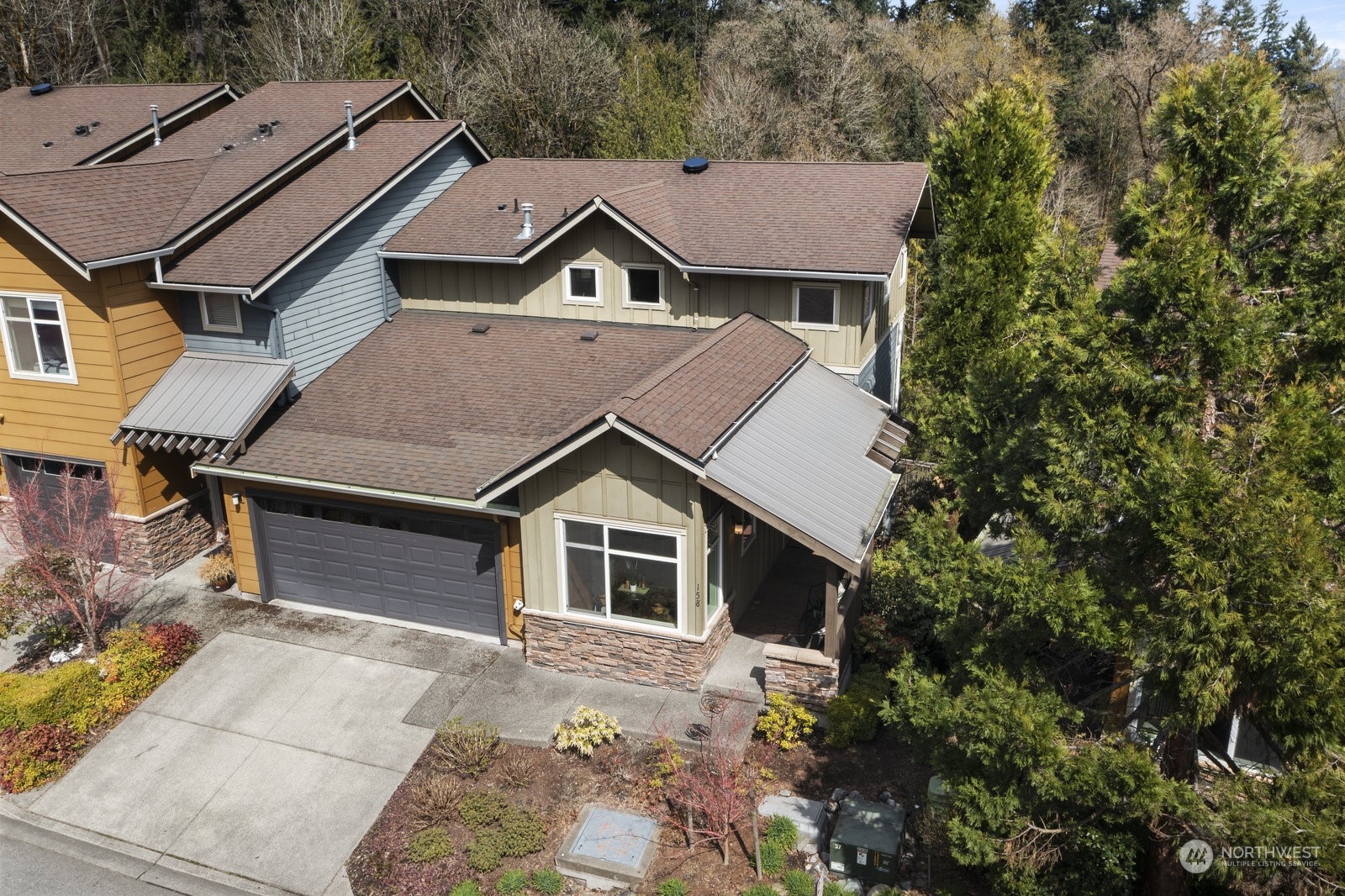 158 Cougar Ridge Road Northwest Issaquah, WA 98027 - Photo 33 of 39 a aerial view of a house with a yard
