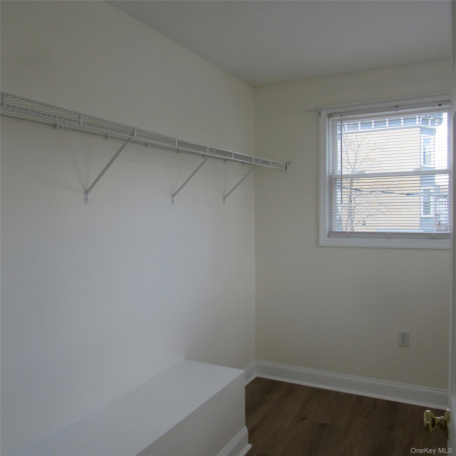 35 Taylor Avenue, Unit 2 Poughkeepsie, NY 12601 - Photo 15 of 19 Walk in closet featuring dark wood finished floors