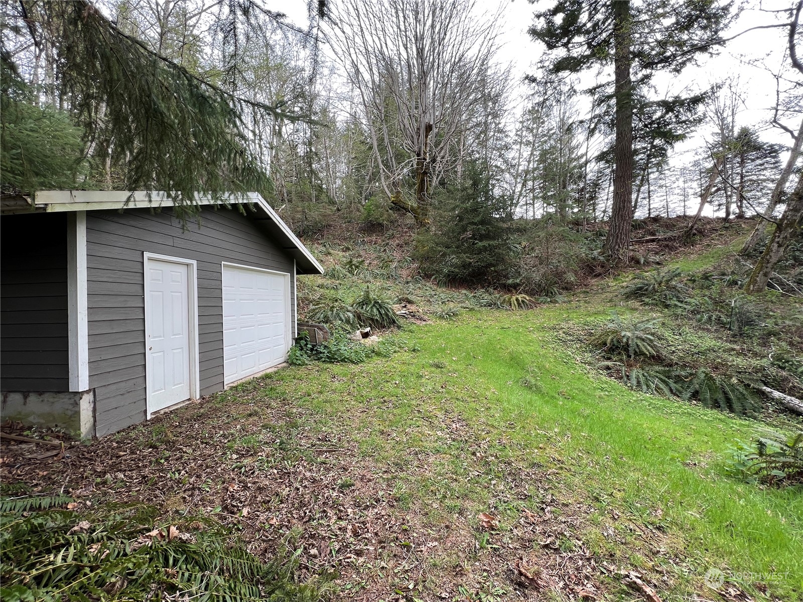 0 Rhododendron Drive Quilcene, WA 98376 - Photo 19 of 36 a view of a house with a yard