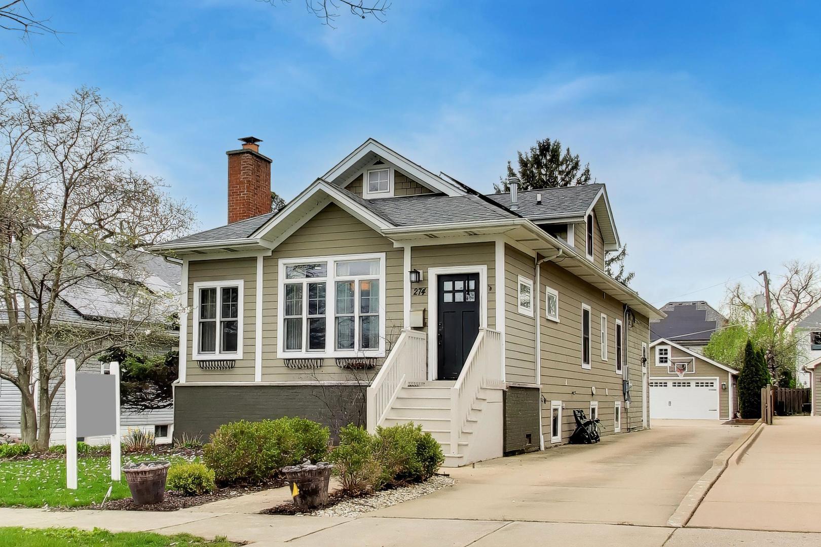 274 Oak Street Elmhurst, IL 60126 - Photo 1 of 31 a front view of a house with a yard