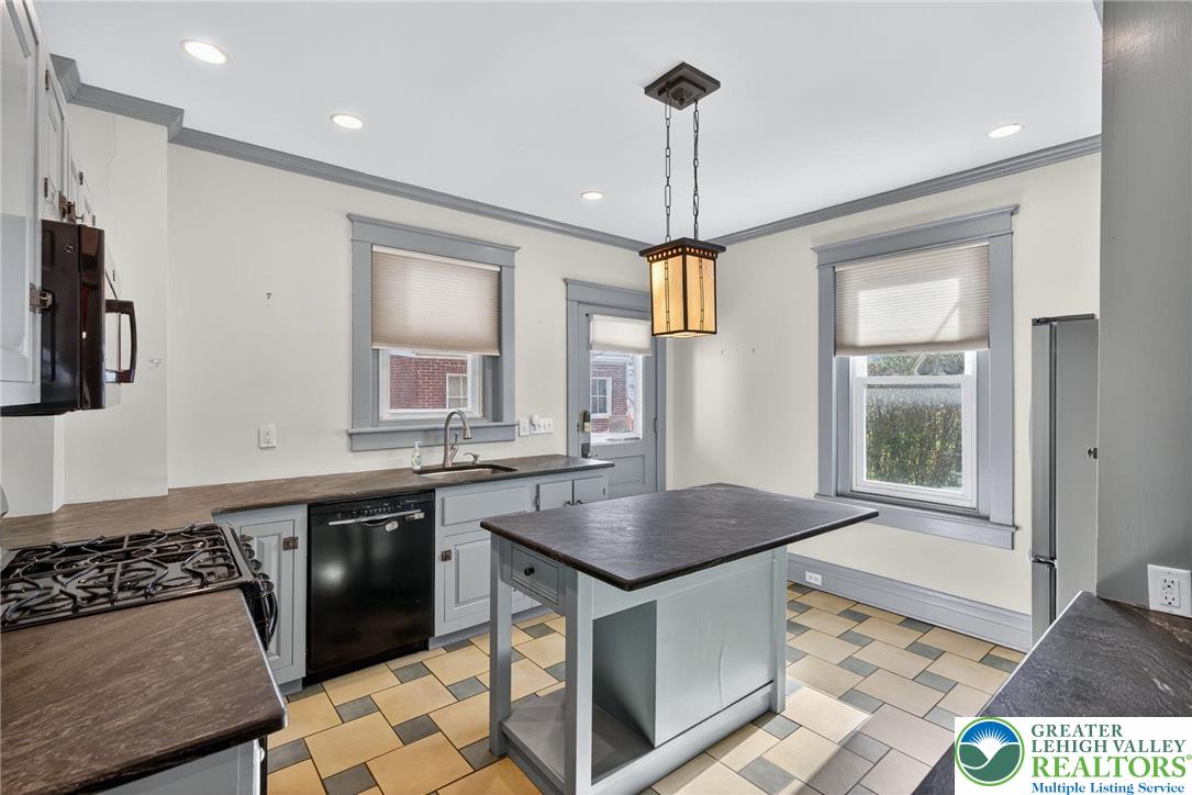1036 Maple Street Bethlehem, PA 18018 - Photo 15 of 48 a kitchen with stainless steel appliances granite countertop a sink stove and refrigerator