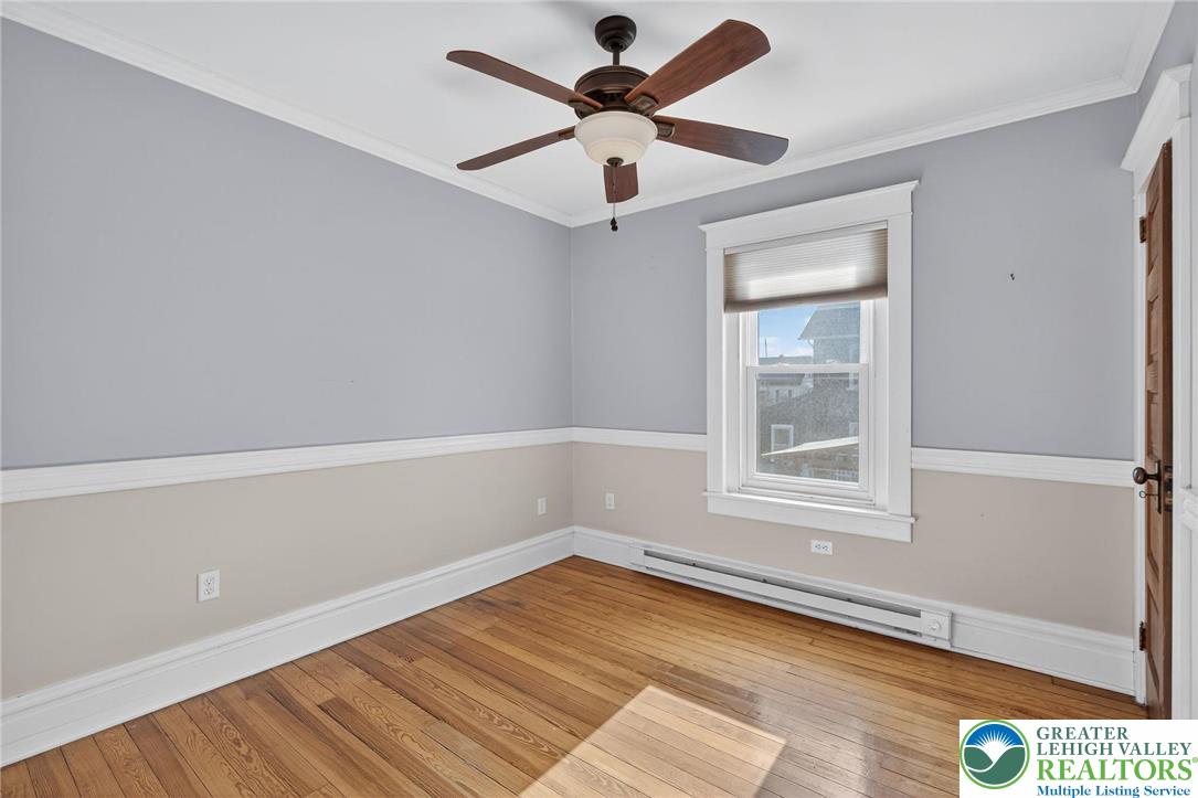 1036 Maple Street Bethlehem, PA 18018 - Photo 24 of 48 wooden floor in an empty room with a window