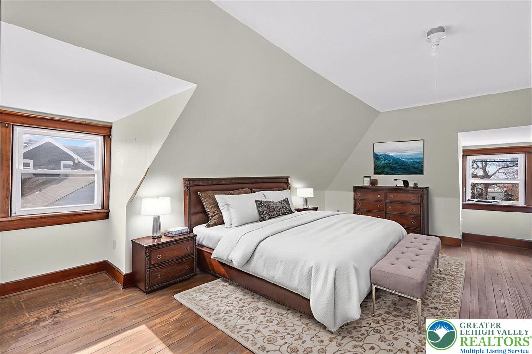 1036 Maple Street Bethlehem, PA 18018 - Photo 33 of 48 a bedroom with a bed and wooden floor