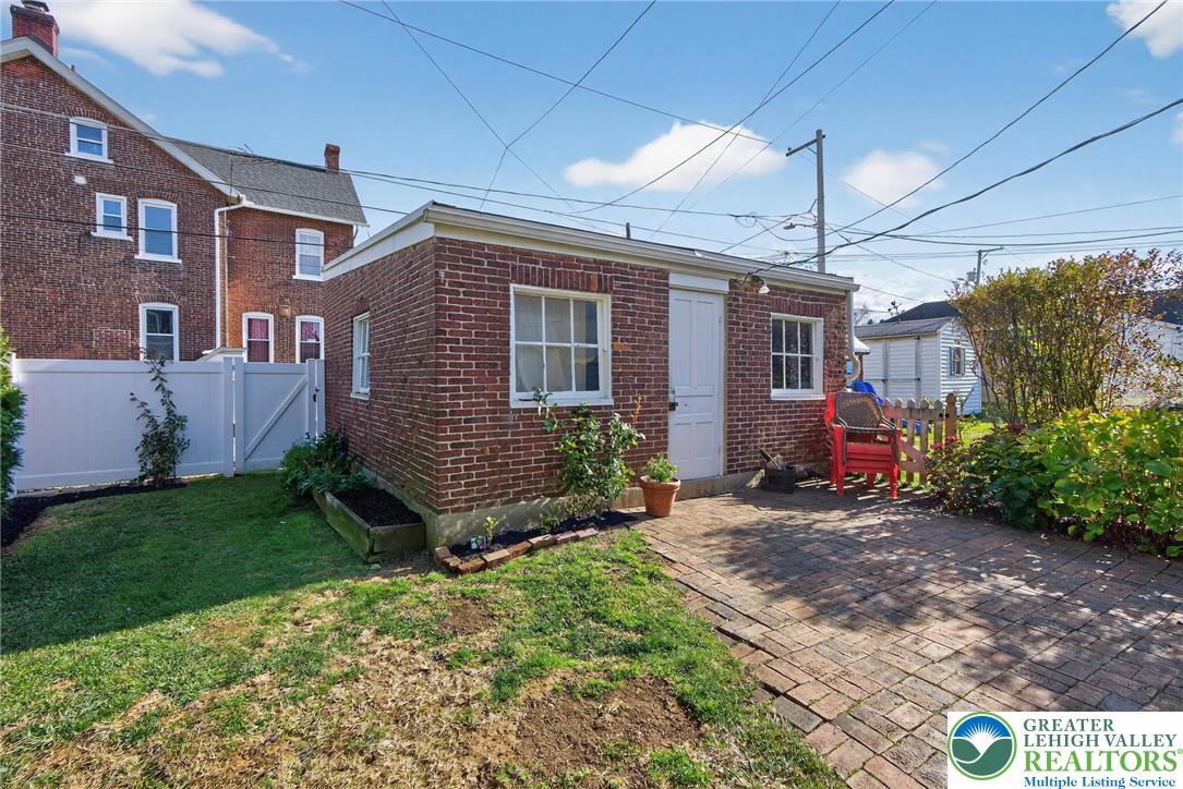 1036 Maple Street Bethlehem, PA 18018 - Photo 43 of 48 a view of a house with a yard and plants